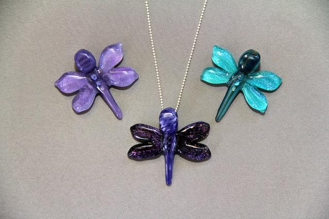 image of three dragonflies